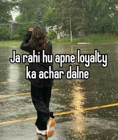 a person walking in the rain with an umbrella and text that reads, ja rah hu