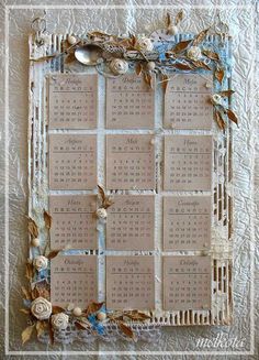 an old photo frame decorated with shells and flowers on a quilted tablecloth background