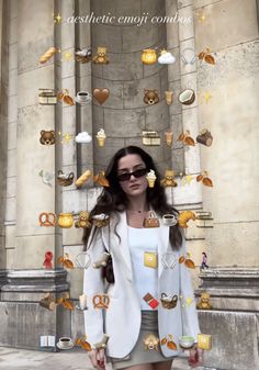 a woman standing in front of a building with lots of decorations on the wall and around her