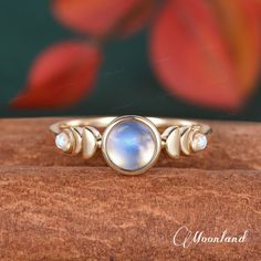 "14K Gold Bezel Moonstone Engagement Ring Phases of the Moon Wedding Ring Yellow Gold Stacking Ring Celestial Minimalist Jewelry Women Ring Check the Rose Quartz ring: https://www.etsy.com/listing/1436299442 🌙 Product Details -Center Stone: 6mm Round Natural Moonstone, Top AA Grade -Side Stone: 2mm Round Moonstone -Ring Band: 1.8mm -Metal Choice: 10K, 14K or 18K Solid Gold (Rose, White, or Yellow)  **Handmade in the US The making process is about 3-4 weeks!! 🌙 Ring Box(Limited time US$1): Get Crescent Moonstone Anniversary Ring, Crescent Moonstone Ring For Anniversary, Celestial Moonstone Ring With Moon Phase For Wedding, Moon Shaped Moonstone Wedding Ring, Wedding Crescent Moonstone Ring With Moon Phase, Moonstone Moon Phase Wedding Jewelry, Gold Moonstone Ring With Moon Phase For Wedding, Celestial Moon-shaped Moonstone Wedding Ring, Minimalist Moonstone Moon-shaped Ring