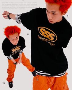 a young man with red hair wearing an orange pants and black t - shirt is standing in front of a white background