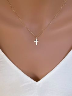 Dainty 14k Gold fill Cross Necklace Woman. Super cute small cross necklace is great gift for her Christmas, This necklace is made of.... -14k gold fill 15mm cross pendent, and -14k gold fill cable chain with spring clasp, -Come up with beautiful ribbon gift box and -One set of Care instruction package. MORE CROSS JEWELRY https://www.etsy.com/shop/rainbowearring?search_query=CROSS MORE LAYERED NECKLACES https://www.etsy.com/shop/rainbowearring1?section_id=17891444&ref=shopsection_leftnav_5 CO Minimalist Crucifix Jewelry With Delicate Chain, Minimalist Cross Charm Necklace With Delicate Chain, Simple Cross Jewelry With Delicate Chain, Dainty 14k Gold Cross Necklace With Delicate Chain, Dainty 14k Gold Cross Necklace, Simple Yellow Gold Cross Necklace, Minimalist Cross Pendant Charm Necklace, Dainty 14k Gold Cross Pendant Charm Necklace, Simple Cross Clavicle Chain Jewelry