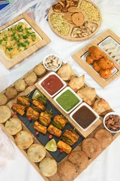 an assortment of food items displayed on wooden trays