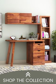 a wooden desk sitting in front of a book shelf