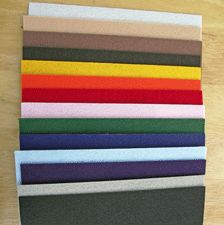 several different colors of fabric laid out on top of each other