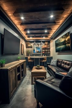 a living room filled with furniture and a flat screen tv mounted to the wall next to a bar