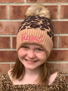 Every girl needs this Blessed Leopard Print Beanie as a reminder of how precious and blessed they are. These knit hats are warm, cozy & stylish and a great beanie for Chilly Winter Days. The word blessed is embroidered on the tan cuff of the hat in hot pink thread. The Pom-Pom is removable.  Premium Animal Print Women Fur Pom-Pom Beanies - Taupe Winter Warm Long Knit Thick Ribbed Cuffed Soft Ladies Beanie Hat Thick & Soft Removable Pom-pom 100% Acrylic One size fits most (It stretches) Leopard Print Beanie, Fur Pom Pom Beanie, Pink Thread, Knit Hats, Long Knit, Pom Beanie, Skull Cap Beanie, Winter Days, Fur Pom Pom