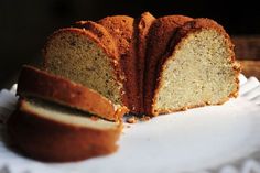 a sliced loaf of cake sitting on top of a white napkin