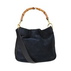 Gucci vintage bamboo handbag in navy blue suede and leather with a top push button closure in gold hardware. Features a single bamboo handle with a detachable shoulder strap, and grey canvas lining with an inner zip pocket. Brand = Gucci Condition = 8/10, Very good. Some wear in suede. c Dimensions = 11" x 9.75" x 3.5" Top Handle = 5" Strap Drop = 18" Material = Suede/Leather Hardware = Gold SKU = 20245-104 Bamboo Handbag, Navy Handbag, Gucci Vintage, Gucci Bamboo, Leather Hardware, Scarf Jewelry, Sneaker Collection, Blue Suede, Push Button