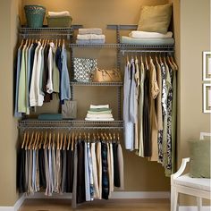 an organized closet with clothes and shoes