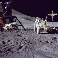 an astronaut on the moon next to a vehicle