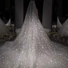 a white wedding dress with stars on it