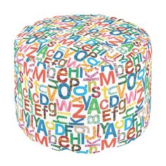 a colorful ottoman that has letters all over it