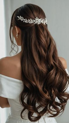 the back of a woman's head wearing a bridal hair comb