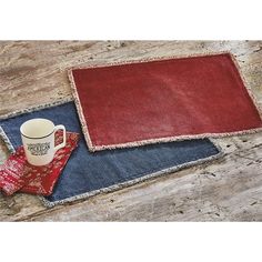 two placemats with coffee cups on them, one is red and the other blue