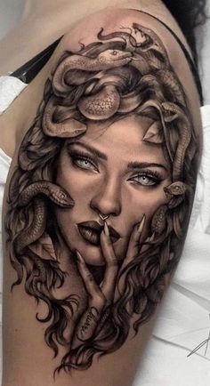 a woman's face with snakes on her head and hands in the shape of a snake