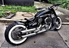 a black and white motorcycle parked on the street