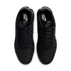 Nike's Air Max Plus is a hybrid sneaker that blends characteristics from some of the brand's most popular styles. This 'Triple Black' edition of the sneaker is given a monochromatic look to emphasize its cutting-edge appeal. The upper is made from a graphic-style textile with undulating TPU stripes, and it features leather panels at the base and heel. Classic Nike logos on the tongue and heel call out the innovative Tuned Air technology that's built into the sneaker. The result is a shoe that's both stylish and comfortable, making it perfect for everyday wear. Nike Tn Air Max, Nike Tn Air, Nike Tn, Max Black, Graphic Style, Mens Nike Shoes, Black Silhouette, Nike Air Max Plus, Air Max Plus