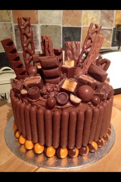 a chocolate cake sitting on top of a wooden table