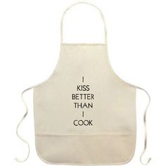 a white apron with words on it that says i kiss better than i cook in black