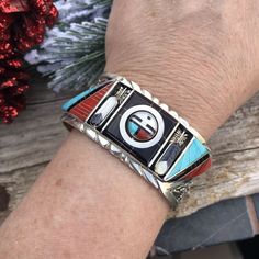 New without tags JEWELRY TYPE : Bracelets MAIN STONE : Multi-Stone TRIBAL AFFILIATION : Zuni ARTISAN : Don Dewa Incredible Vintage Find Right HERE! This Beauty was created by the Famous Zuni Artist Don Dewa. This Bracelet Cuff has Incredible Inlay work & Detail. Turquoise, Onyx, Coral and Mother of Pearl placed so Intricately. Center Design has a two face Design that moves . It is made of Sterling Silver and Multi Stones. The inside circumference is 5 1/4 inches with a 1 1/4 inch gap. Width Two Face, Royston Turquoise, Bracelet Cuff, Face Design, Multi Stone, Silver Turquoise, Bracelet Stack, Pendant Earrings, Turquoise Sterling Silver