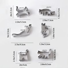 four different sizes of cat shaped cookie cutters on a white background with measurements for each one