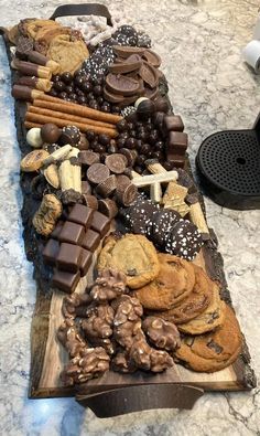 a table topped with lots of cookies and chocolate