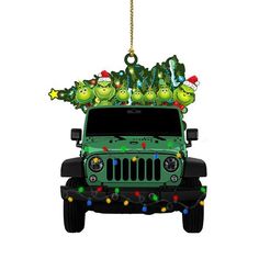 a green jeep with christmas lights on it's roof and grino decorations hanging from the top