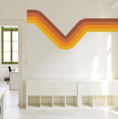 an office with white walls and orange lines painted on the wall