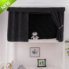 a bed with a black and white checkered canopy over it