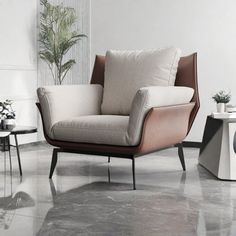 a modern living room with white walls and marble flooring, including a beige chair