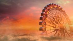 a ferris wheel in the clouds at sunset