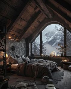 a bedroom with a large window and mountain view in the background, is lit up by candles