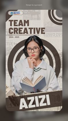 a woman with glasses reading a book in front of a poster that reads team creative azzi