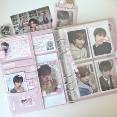 an open pink album with photos and pictures on it