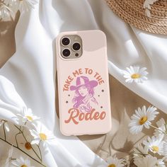 a phone case with the words ride me to the rodeo on it next to daisies