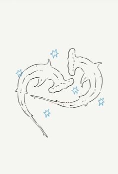 two dolphins swimming in the water with stars on their back and one dolphin jumping out of it's mouth