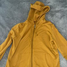 Mustard Yellow Color Hoodie. Never Worn. Very Comfortable. Size Small But Still Fits Somewhat Oversized. Yellow Hoodie With Pockets For Fall, Casual Yellow Hooded Jacket For Fall, Casual Long Sleeve Yellow Hooded Jacket, Fall Yellow Hoodie With Pockets, Yellow Fall Hoodie With Pockets, Yellow Long Sleeve Hoodie, Cheap Yellow Hoodie, Yellow Cotton Sports Hoodie, Yellow Hoodie Sweatshirt With Double-lined Hood