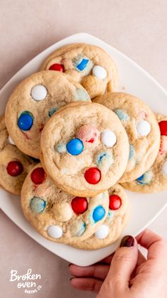 a plate full of cookies with red, white and blue sprinkles