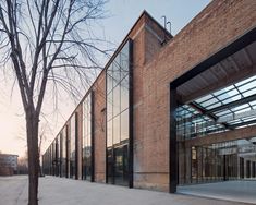 a brick building with lots of glass doors