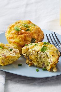 a plate with some muffins on it and a fork sitting next to it