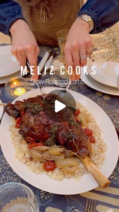 a person cutting up food on top of a plate with utensils in front of them