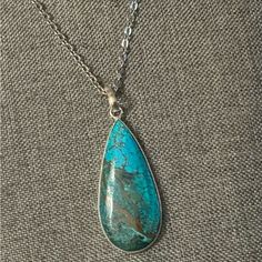 Stunning Blue-Green Turquoise Stone Tear Drop Design Pendant On A Stainless Steel Chain Link Necklace. Charm Size: 1” Wide X 2” Length. Sturdy 30 Inch Necklace With Lobster Claw Clasp. New Hand-Crafted Item. Delivered In Jewelry Gift Box. Blue Bohemian Necklace With Silver Chain, Bohemian Blue Necklace With Silver Chain, Bohemian Blue Jewelry With Silver Chain, Silver Turquoise Teardrop Pendant With Natural Stones, Silver Turquoise Teardrop Pendant Necklace With Natural Stones, Blue Teardrop Turquoise Necklace Nickel Free, Nickel-free Blue Turquoise Teardrop Necklace, Blue Turquoise Teardrop Necklace Nickel Free, Blue Natural Stones Teardrop Pendant Necklace