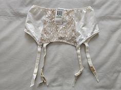 A Vintage NWT Suspender/Garter Belt by Warner's Lingerie from their lovely 'Richness' range, in size 10-12/Aus/UK, 5-6/US, in an all cream/taupe nylon and lace finish. Quadruple clasp on back and 4 suspenders. Colour - Off White Vintage Suspenders, Vintage Garter, Garter Skirt, Lingerie Vintage, Garter Belts, Suspender Belt, Vintage Lingerie, Socks And Hosiery, Suspenders