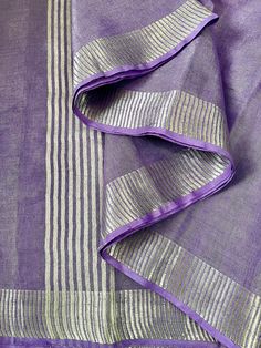 Bring your lavender dreams into reality with this Lavender & Silver Zari tissue linen  Plain Shimmer Saree. This saree is elegance overloaded. You can get so many different looks just by switching blouses.  Saree Length 5.5m.  Saree comes with falls & picot/edges done.  Saree comes with Stitched matching blouse which can be selected from Options.  Blouse is available in Sizes 34, 36, 38. Blouse has short sleeves, back opening hooks, high quality lining, tassels & ties . No padding.  Choose size Festive Linen Traditional Wear With Zari Work, Festive Traditional Linen Wear With Zari Work, Festive Linen Traditional Wear For Weddings, Diwali Linen Dupatta, Elegant Lavender Dupatta For Festive Occasions, Elegant Lavender Dupatta Traditional Drape, Elegant Lavender Chanderi Dupatta, Elegant Lavender Dupatta With Zari Work, Festive Linen Saree With Zari Weaving