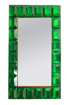 a mirror that is made out of green glass cubes and has a wooden frame