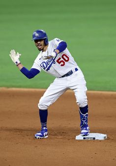 a baseball player standing on top of a field