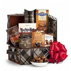 a gift box filled with assorted chocolates, nuts and candies for someone's special occasion