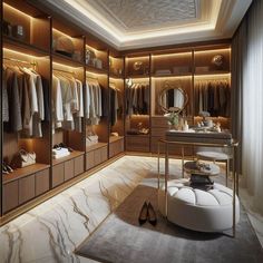 an elegant walk in closet with marble flooring and gold accents, lighted by recessed lighting