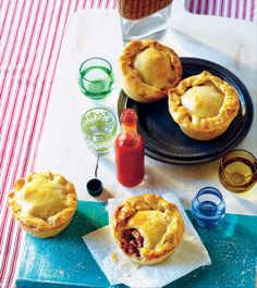 several pies on a table with drinks